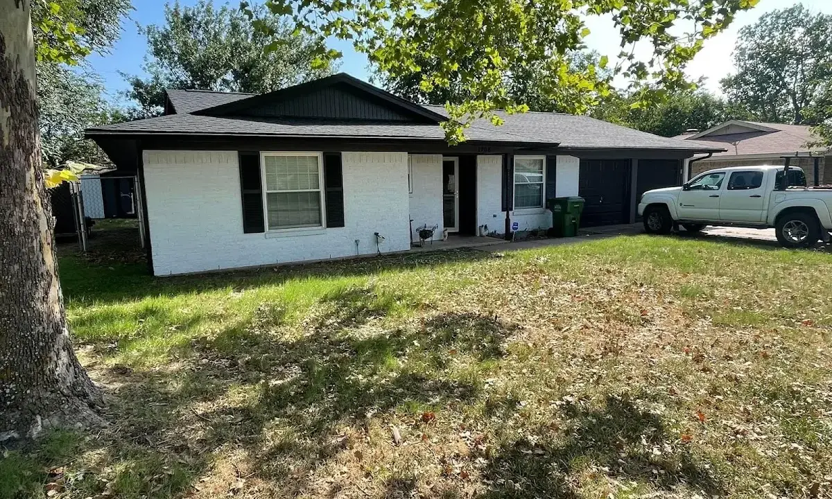 Professional roofing crew working on a residential roof in Hereford